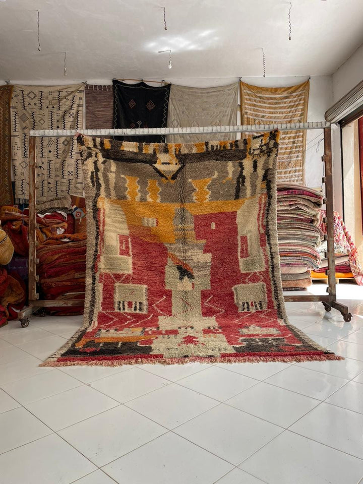 Lifestyle shot of a colorful Moroccan rug with geometric patterns in a natural setting.