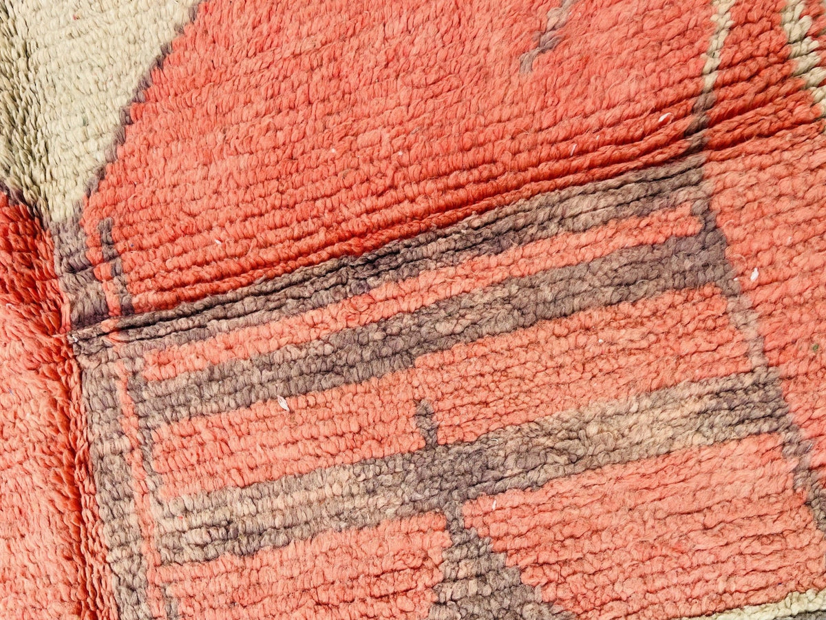 Detail shot of the woven design of the orange geometric Beni Ourain Moroccan rug.