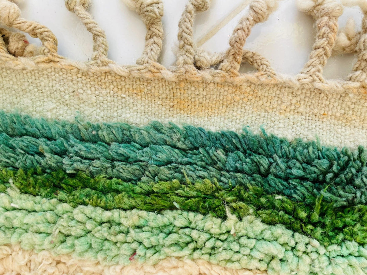 Close-up detail showcasing the layered texture of a yellow Moroccan rug.