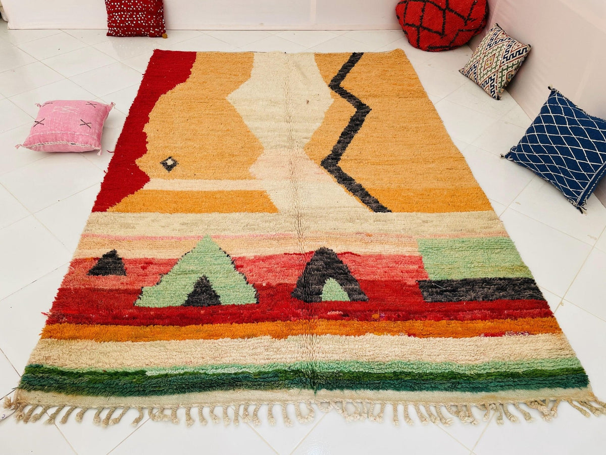Close-up detail of the soft texture and woven design of a yellow Moroccan rug.