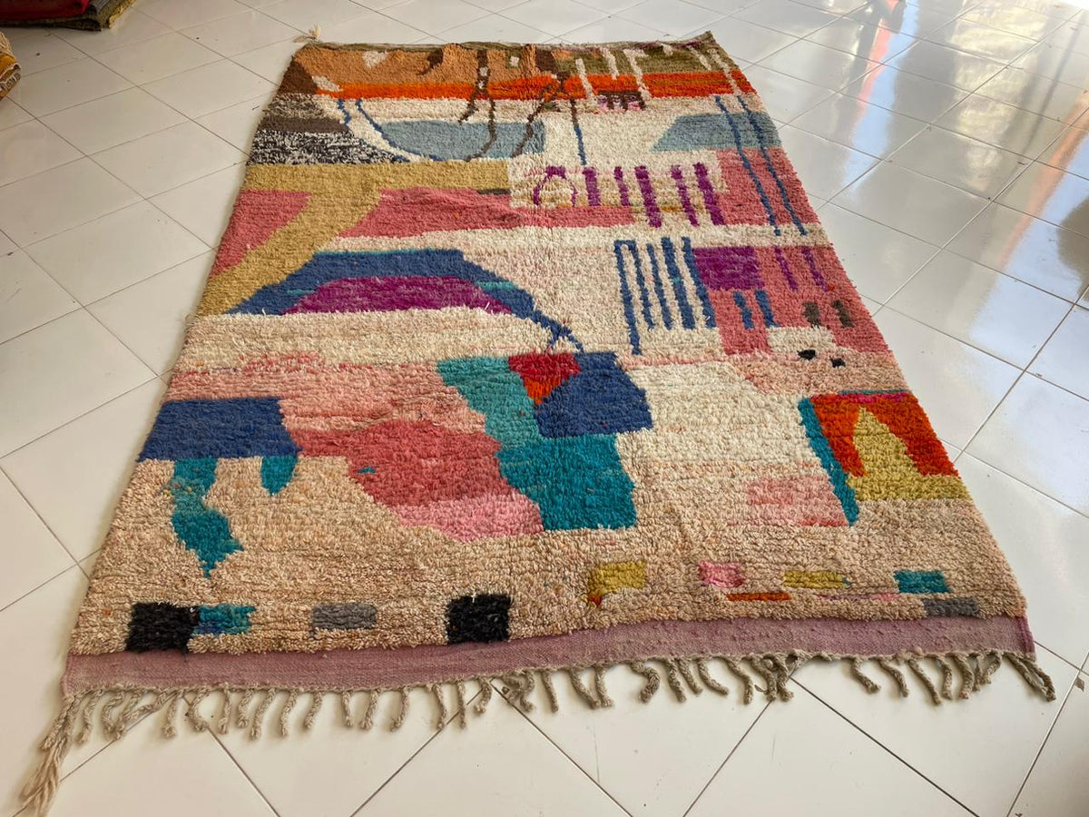 Detail close-up of a colorful Berber rug highlighting geometric patterns and vibrant colors.