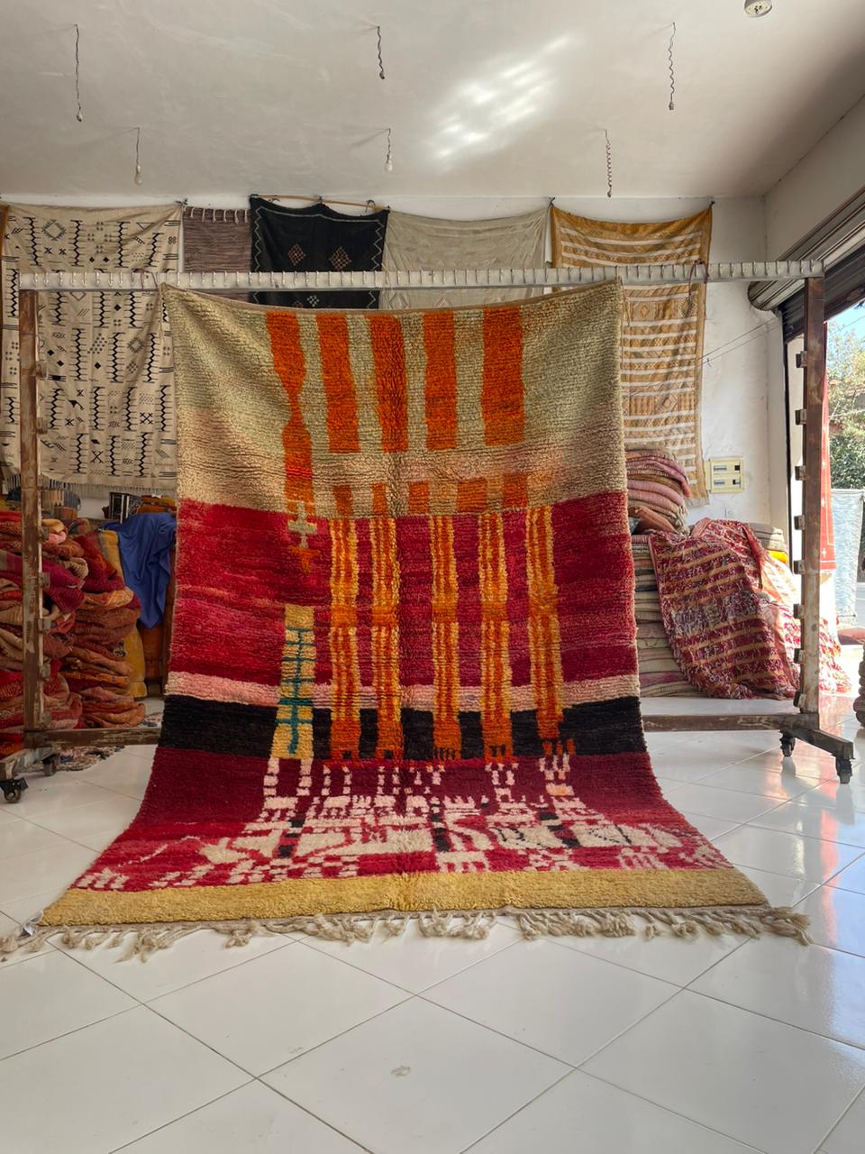 Lifestyle view of a vibrant Berber rug showcasing geometric designs and rich colors.