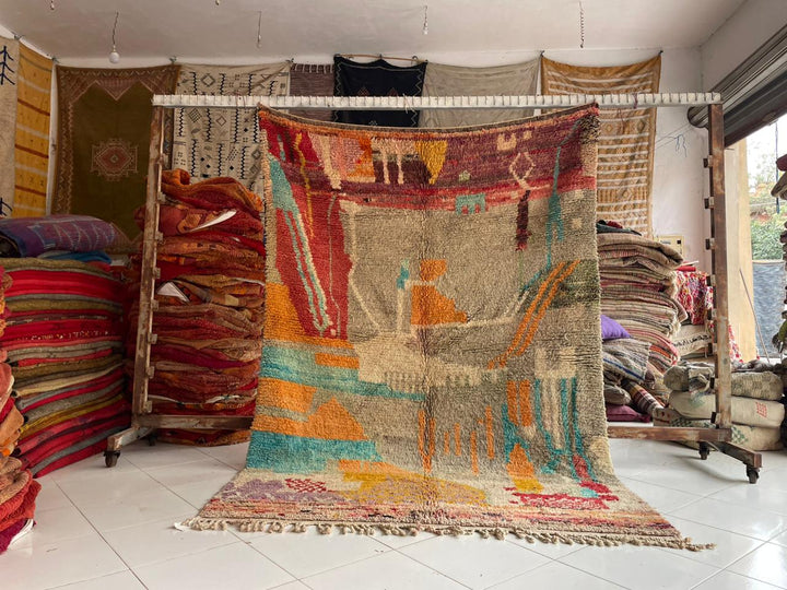 Lifestyle view of a colorful Moroccan rug with geometric patterns in a natural setting.