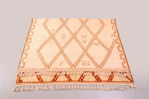 Front view of a brown diamond rug showcasing its diamond pattern and thick pile.