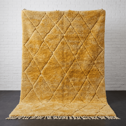 Front view of the mustard yellow Moroccan rug showcasing fringe edges.