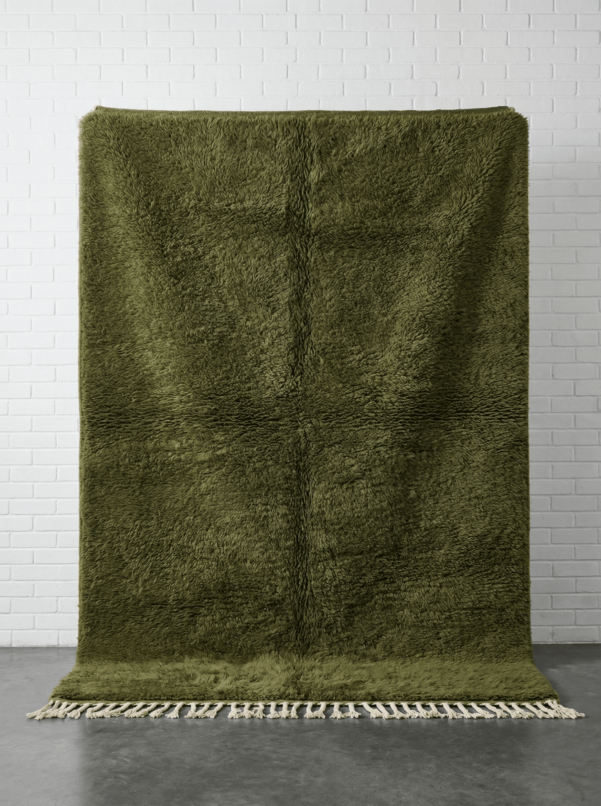 Front view of the olive green Moroccan rug featuring a tribal design on a white background.