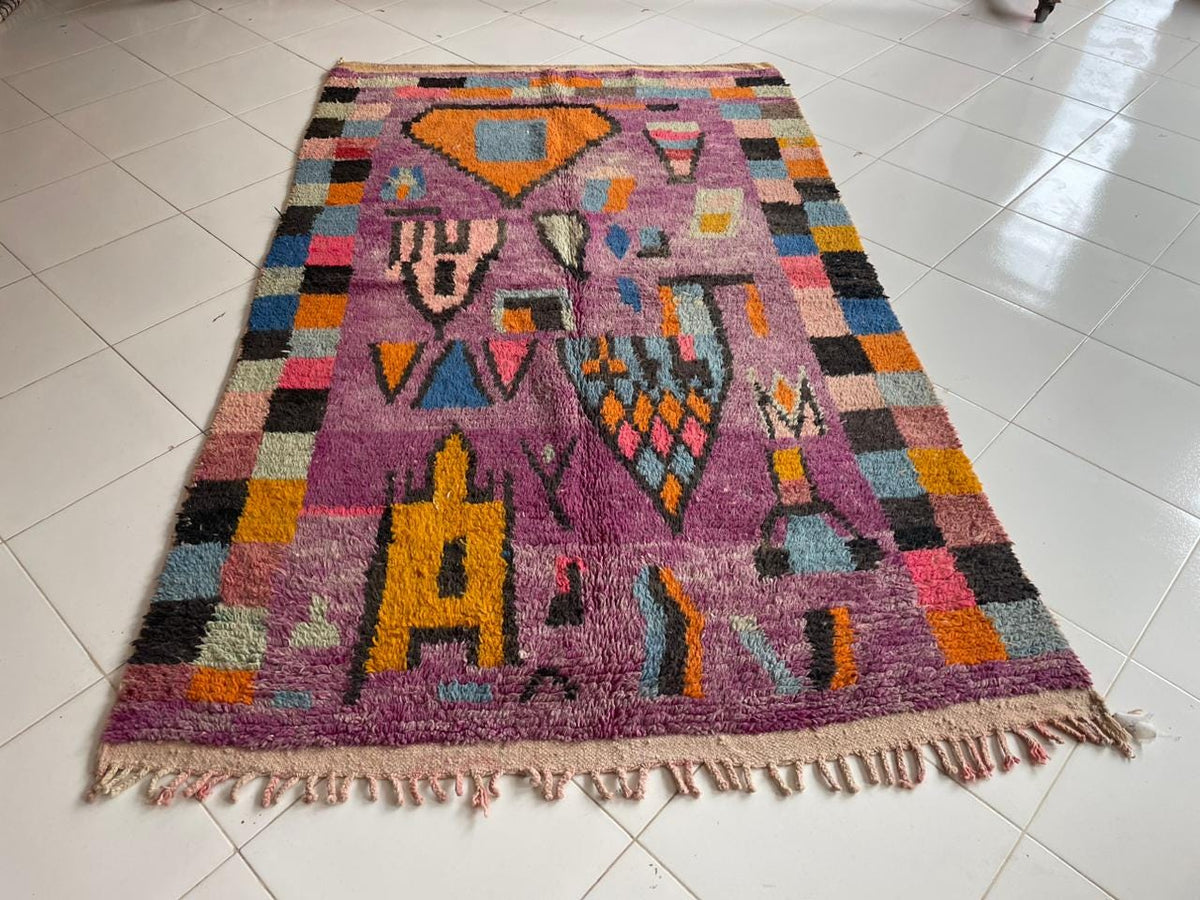 Front view of a vintage Moroccan rug showcasing vibrant colors and geometric designs.