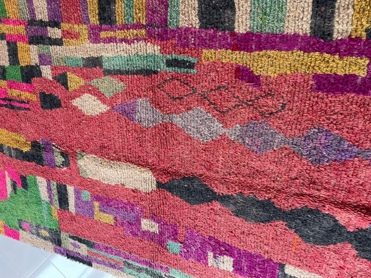 Detail view of the vintage Moroccan rug featuring colorful patterns and textures.