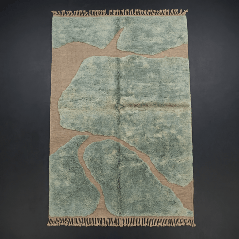 Front view of the sage green Moroccan rug with an abstract pattern on a solid color background.