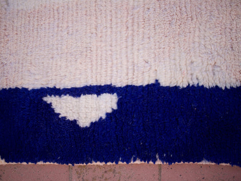 Front view of the pink Moroccan rug highlighting its soft texture and boho style.