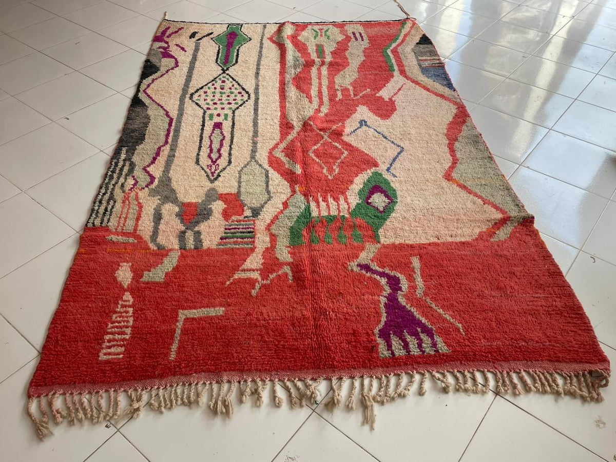 Lifestyle view of a vintage Moroccan rug showcasing its colorful geometric patterns.