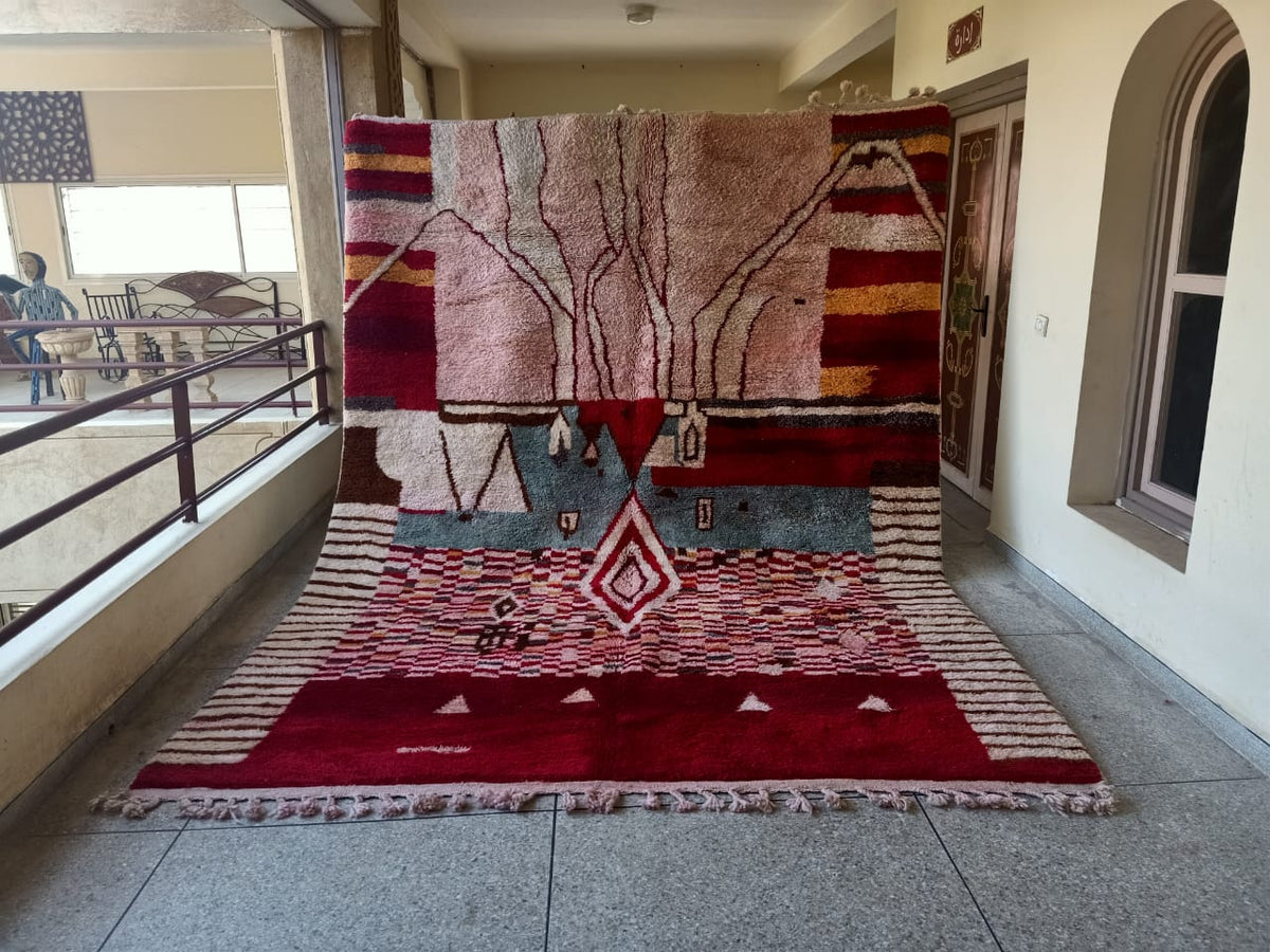 Front view of a large red and cream ikat Moroccan Mrirt rug showcasing its patterns.