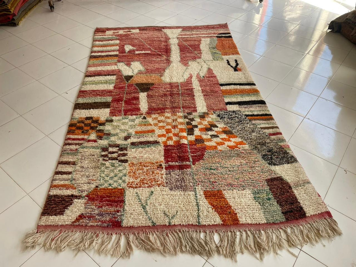 Front view of a vintage Moroccan rug showcasing vibrant colors and geometric designs.
