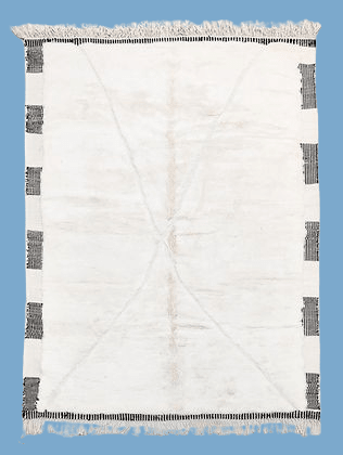 Front view of a white and black tufted rug with geometric pattern on a solid background