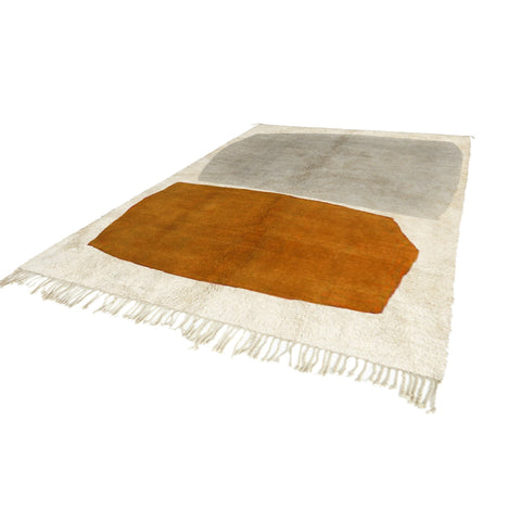 Front view of an abstract Moroccan rug featuring orange, gray, and cream colors.