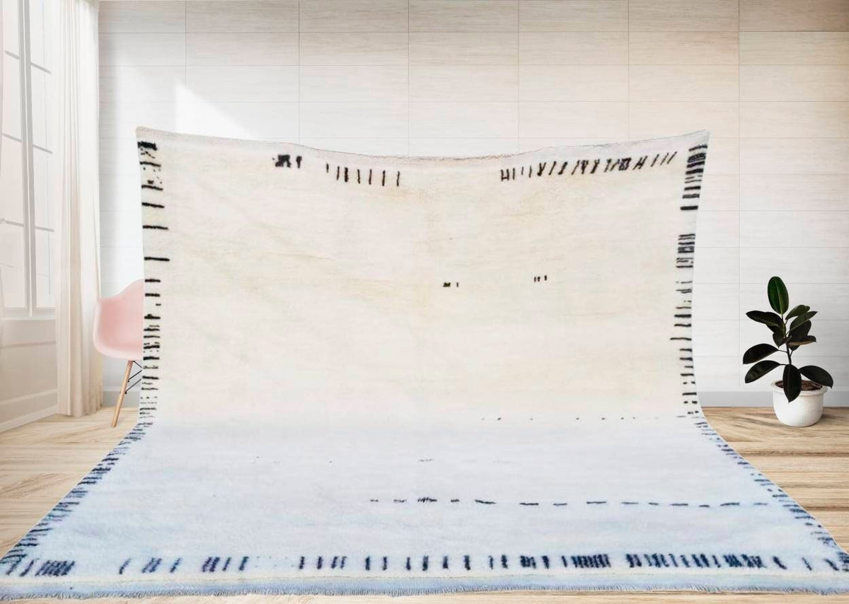 Lifestyle shot of the abstract black and white Moroccan rug featuring geometric patterns.