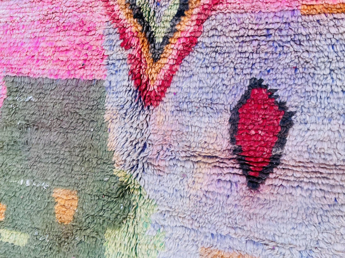 Front view of the vintage Moroccan rug displaying colorful patterns and design.