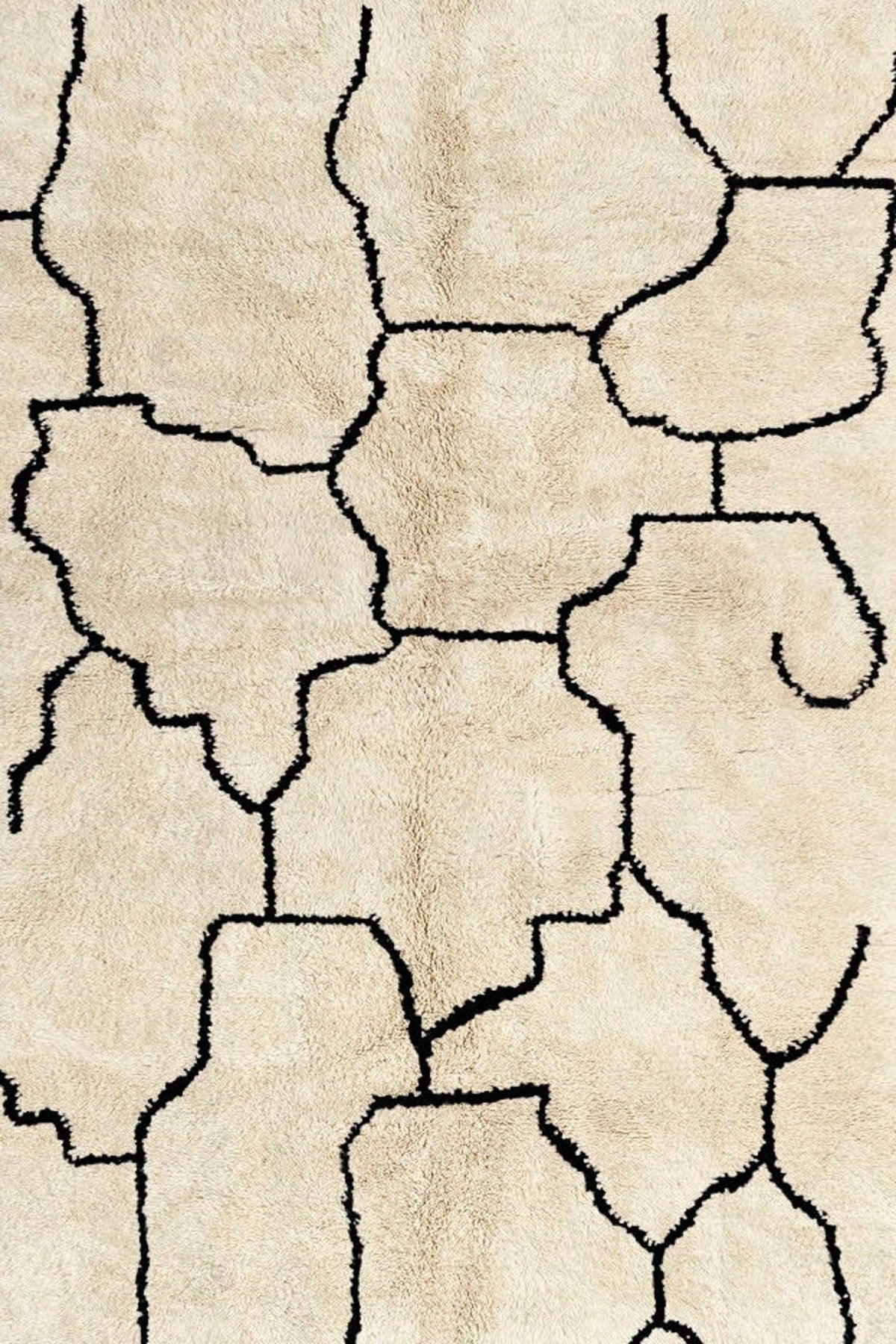 Front view of the beige lattice Beni Ourain Moroccan rug showcasing abstract black and off-white design.