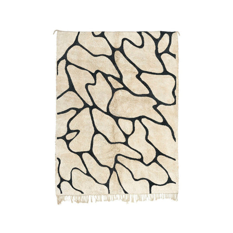 Front view of the black and off-white Beni Ourain Moroccan rug with an abstract pattern.