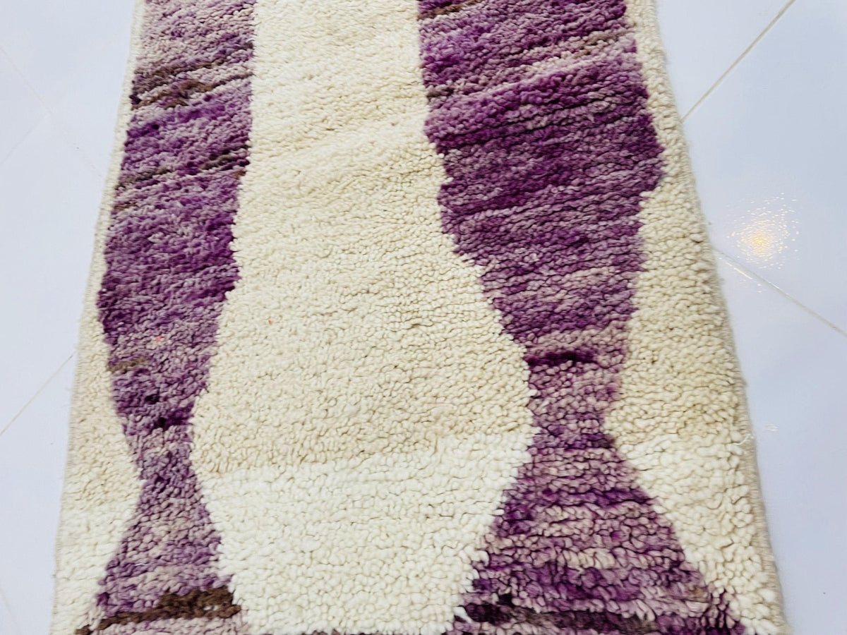 Detail shot of the cream geometric vintage Moroccan runner rug, focusing on its abstract design.