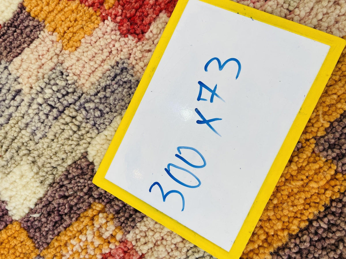 Close-up detail of the rug label featuring handwritten text.