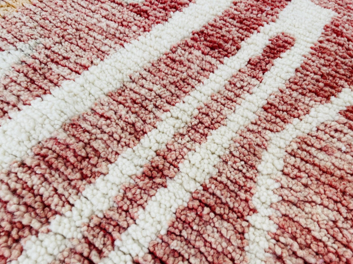 Close-up detail of a striped pattern rug with a soft texture.