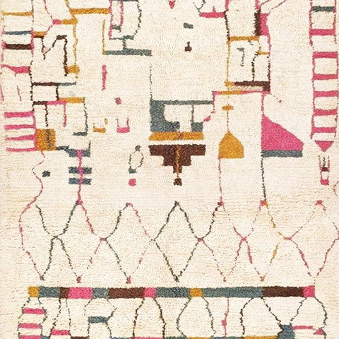 Detail close-up showcasing tribal patterns in a Moroccan rug featuring beige, red, and yellow colors.