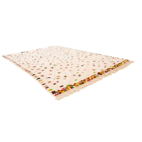 Side view of a colorful Moroccan rug featuring a polka dot pattern and fringed edges.