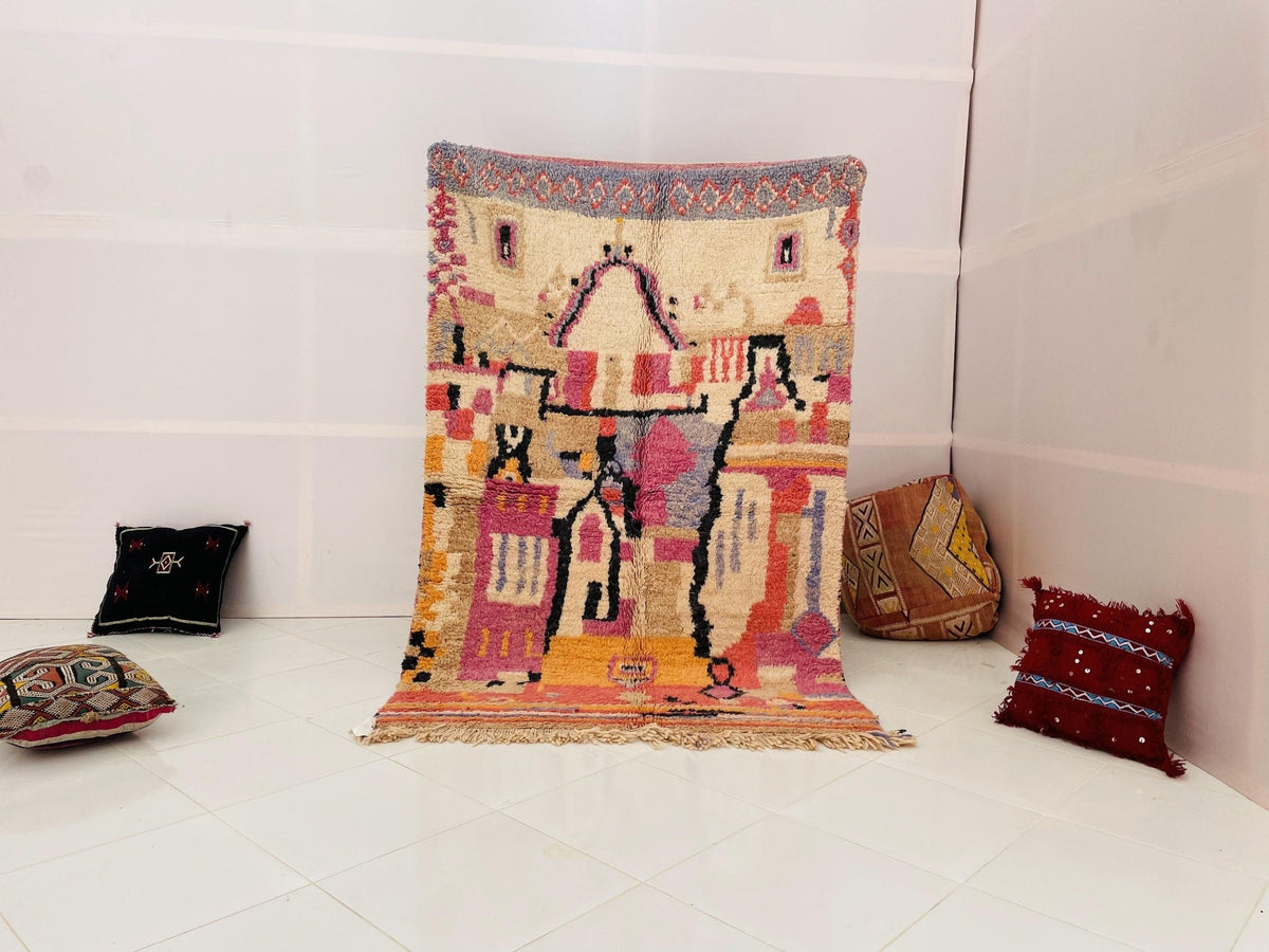 Lifestyle shot of a vintage Moroccan rug featuring red, yellow, and black tribal patterns.
