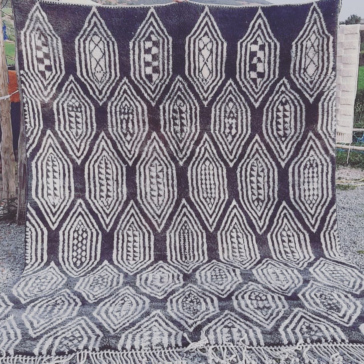 Front view of the gray checkered Moroccan rug featuring a geometric black and white design.