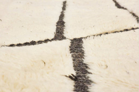 Front view of the cream geometric line rug showcasing abstract black and off-white design.