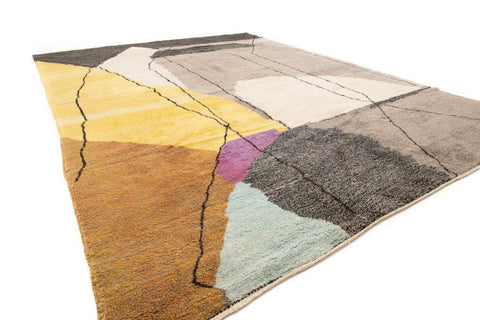 Front view of the gray, black, and mustard abstract rug showcasing its geometric pattern.