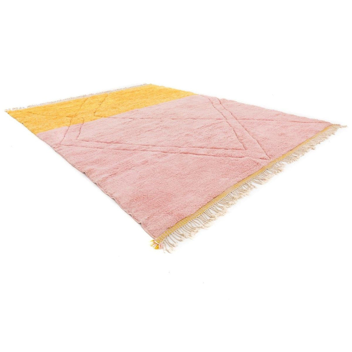 Lifestyle shot of the pink and yellow rug in a room setting, showcasing large size and soft surface.