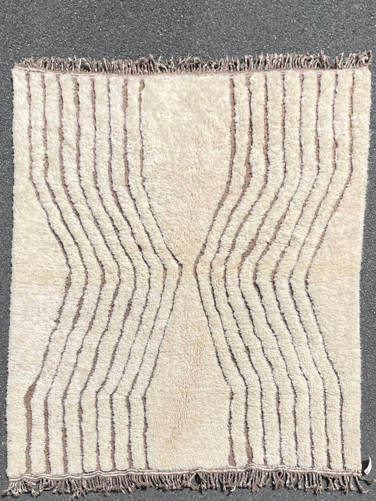 Front view of the Soft Ivory Textured Custom Beni Ourain Moroccan Rug displaying a striped pattern and fringe detail.