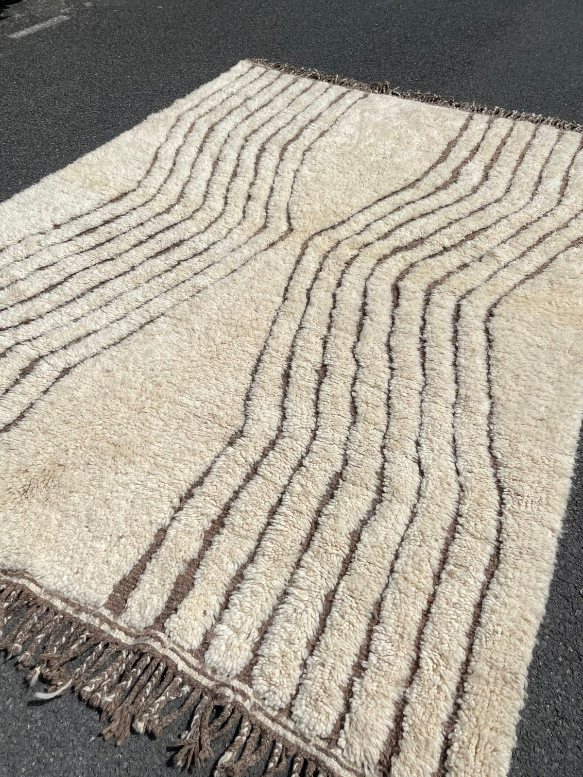Front view of the Soft Ivory Textured Custom Beni Ourain Moroccan Rug featuring a geometric design and fringed edges.