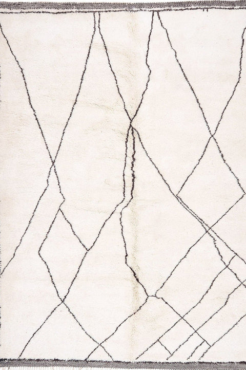 Close-up view of the textured pattern on the black and off-white rug.