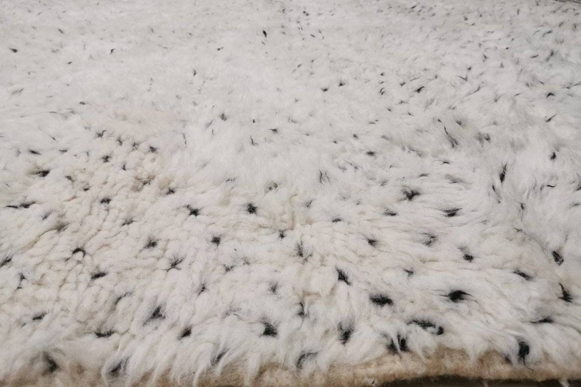 Close-up detail showcasing the geometric design of the Moroccan rug.