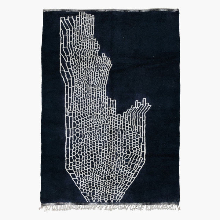 Front view of a black and gray abstract Moroccan rug with geometric patterns.