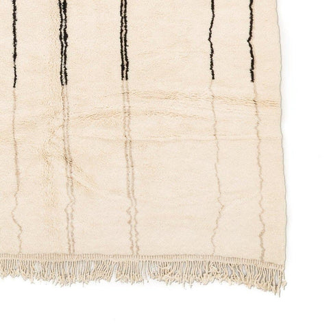 Detail view of the striped design on the beige striped Moroccan rug.