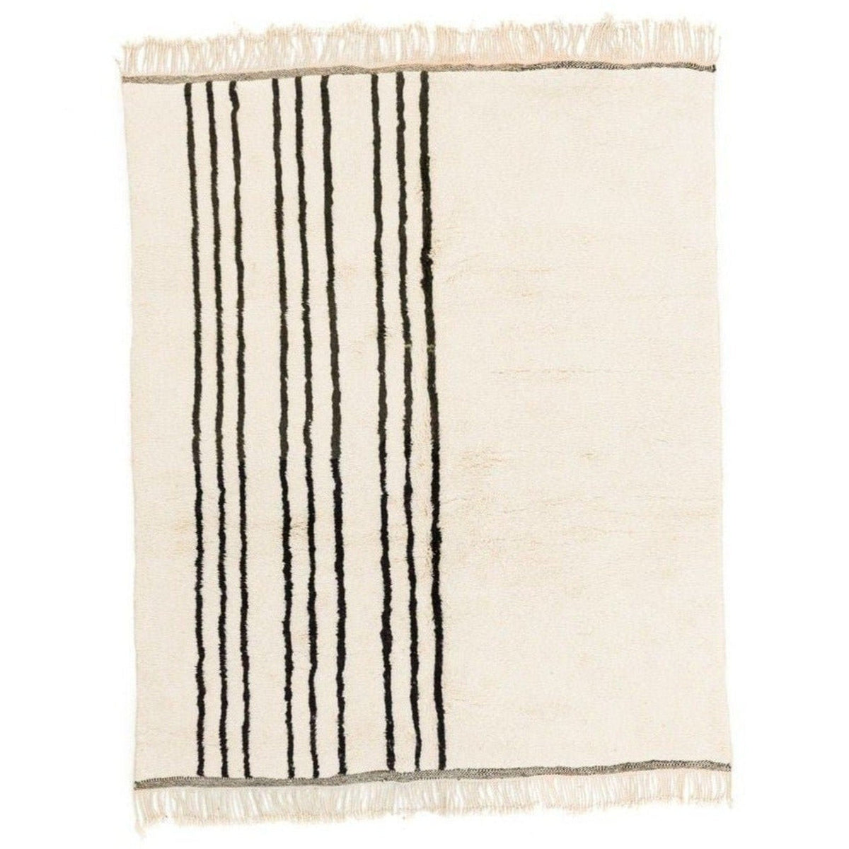 Detail close-up of black and white striped area rug with Moroccan design.