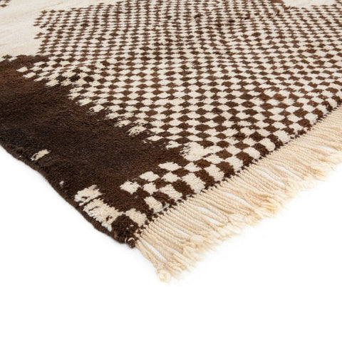 Detail shot highlighting the checkered pattern and soft texture of the rug.
