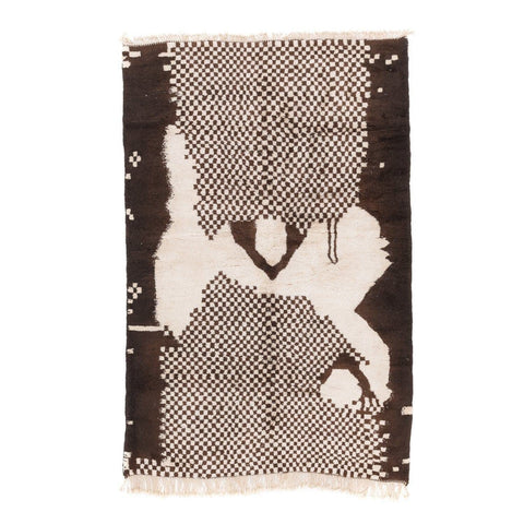 Detail view of a black and white tribal pattern on a Moroccan rug.