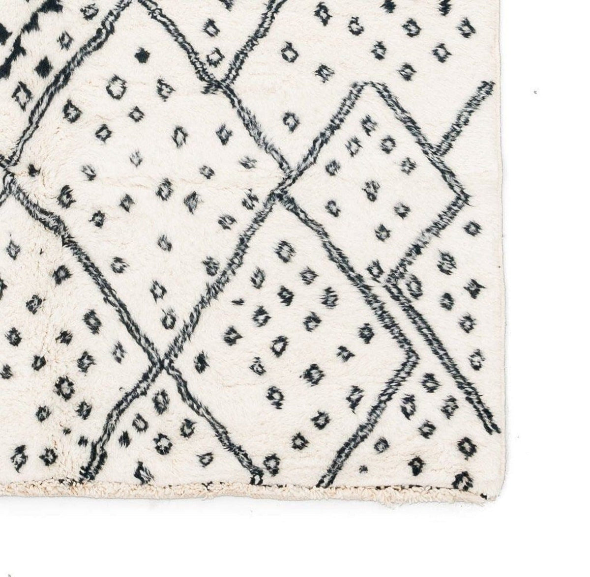 Front view of the ivory geometric tribal area rug showcasing a black tribal design.