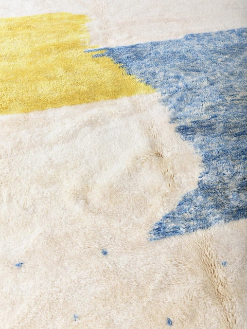Front view of the blue and yellow color block rug showcasing its abstract design.
