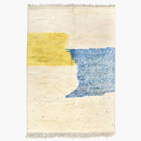 Front view of the blue and yellow color block rug with an abstract design.