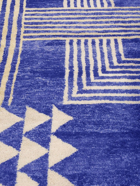 Close-up detail of the blue Beni Mrirt rug emphasizing its soft texture and geometric design.
