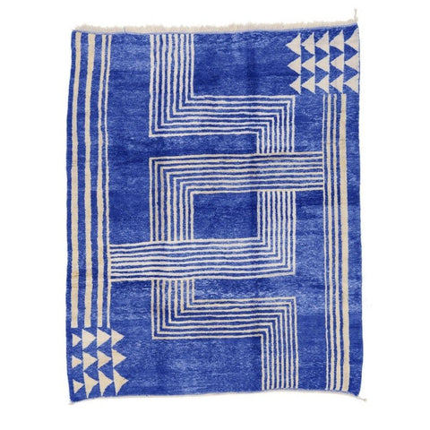 Front view of the blue Beni Mrirt rug showcasing geometric patterns and a cream background.