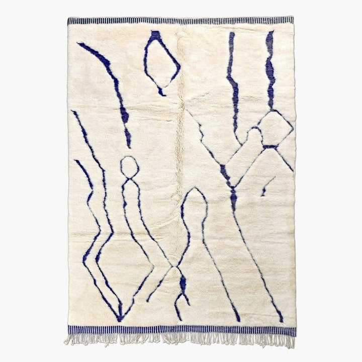 Front view of a blue and cream linear Moroccan rug with an abstract design.