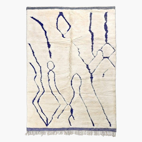 Front view of a blue and cream linear Moroccan rug with an abstract design.