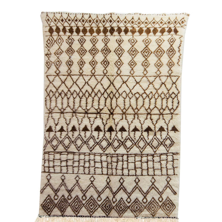 Front view of the brown striped Moroccan rug featuring tribal patterns in black and off-white.
